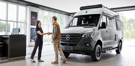 a Mercedes Benz Dealership with the text "Schedule A Test Drive" over it.